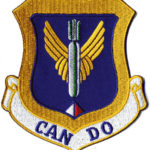 The 305th Bombardment Wing logo patch with a bomb with wings on a blue background and gold border. The words Can Do are along the bottom.