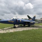 Side view of the F-11 Tiger planted in the scheme of the Blue Angels.