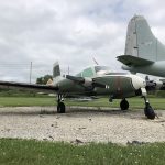 A side view of the U-3A Blue Canoe in a green and white color scheme