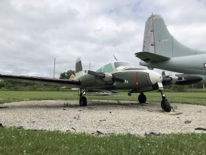 A side view of the U-3A Blue Canoe in a green and white color scheme