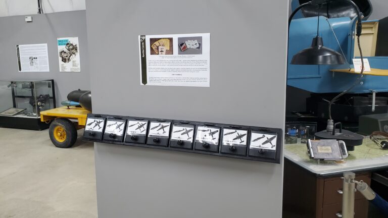 A picture of the Spotter Card interactive with interpretation sign.