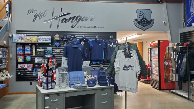A view of The GIft Hangar gift shop, including some of its merchandise like shirts, hats and toys.