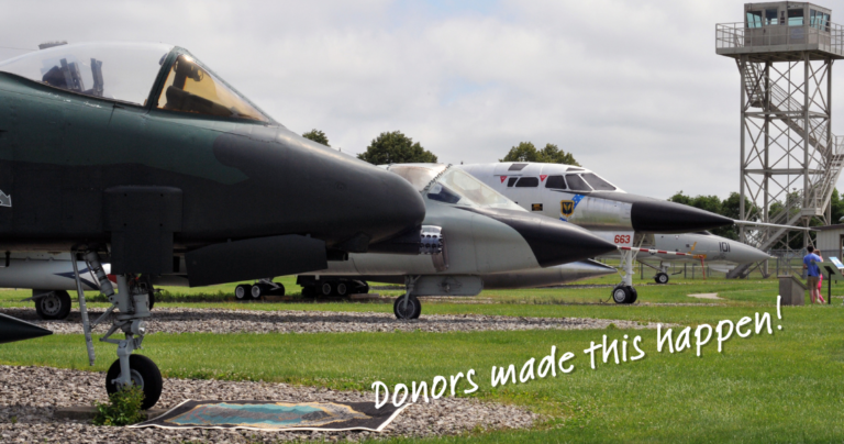 Image of the noses of the A-10, TF-102, and B-58 along with the Guard Tower in the background with the words "Donors make this happen" overlaid