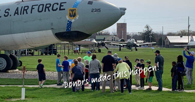 Image of a youth tour with volunteers with the words "Donors make this happen" overlaid